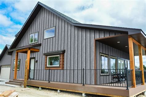 ranch house with gray siding & charcoal metal roofing|brown siding for ranch style homes.